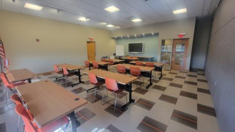 Meeting room set up classroom style with SmartBoard