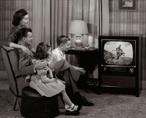 A family watching television in the 1950s